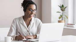 Distance education, e-learning concept. Woman using laptop computer at home, studying online. Student girl working in her room. Work or study from home, business, creative occupation, meeting online