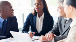 group of businesspeople having a meeting in modern office