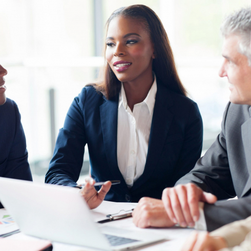 group of businesspeople having a meeting in modern office